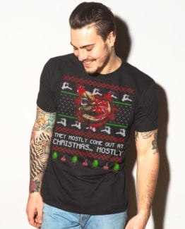 They Mostly Come Out At Christmas Graphic T-Shirt - black shirt design on a model