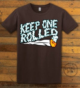 This is the main graphic design on a brown shirt for the Weed Shirt: Keep One Rolled