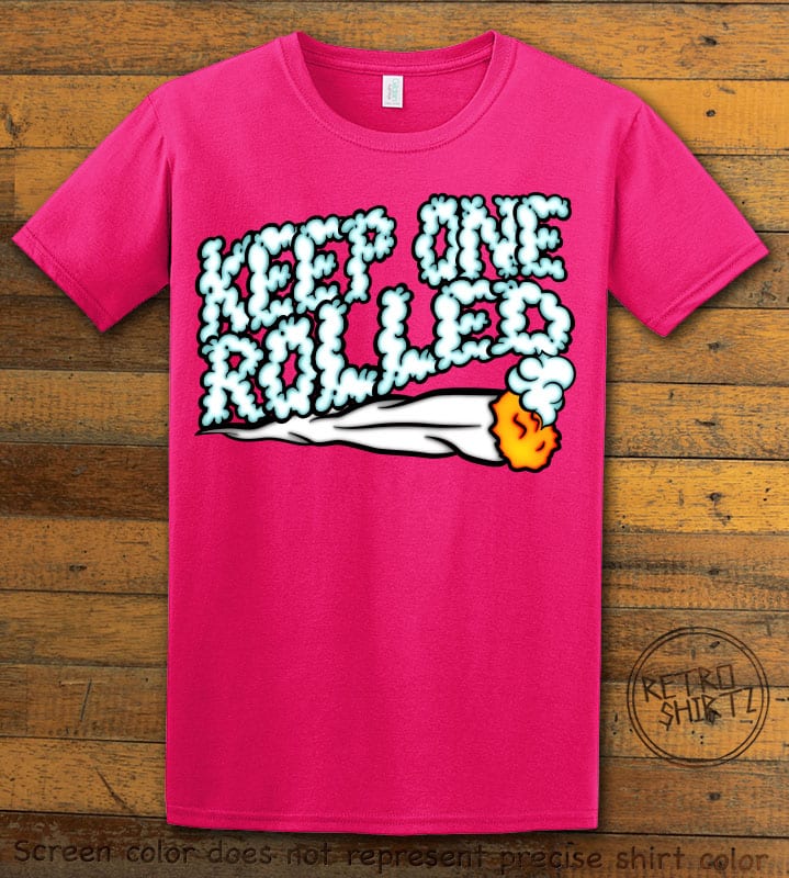 This is the main graphic design on a pink shirt for the Weed Shirt: Keep One Rolled