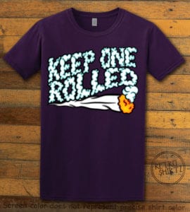 This is the main graphic design on a purple shirt for the Weed Shirt: Keep One Rolled
